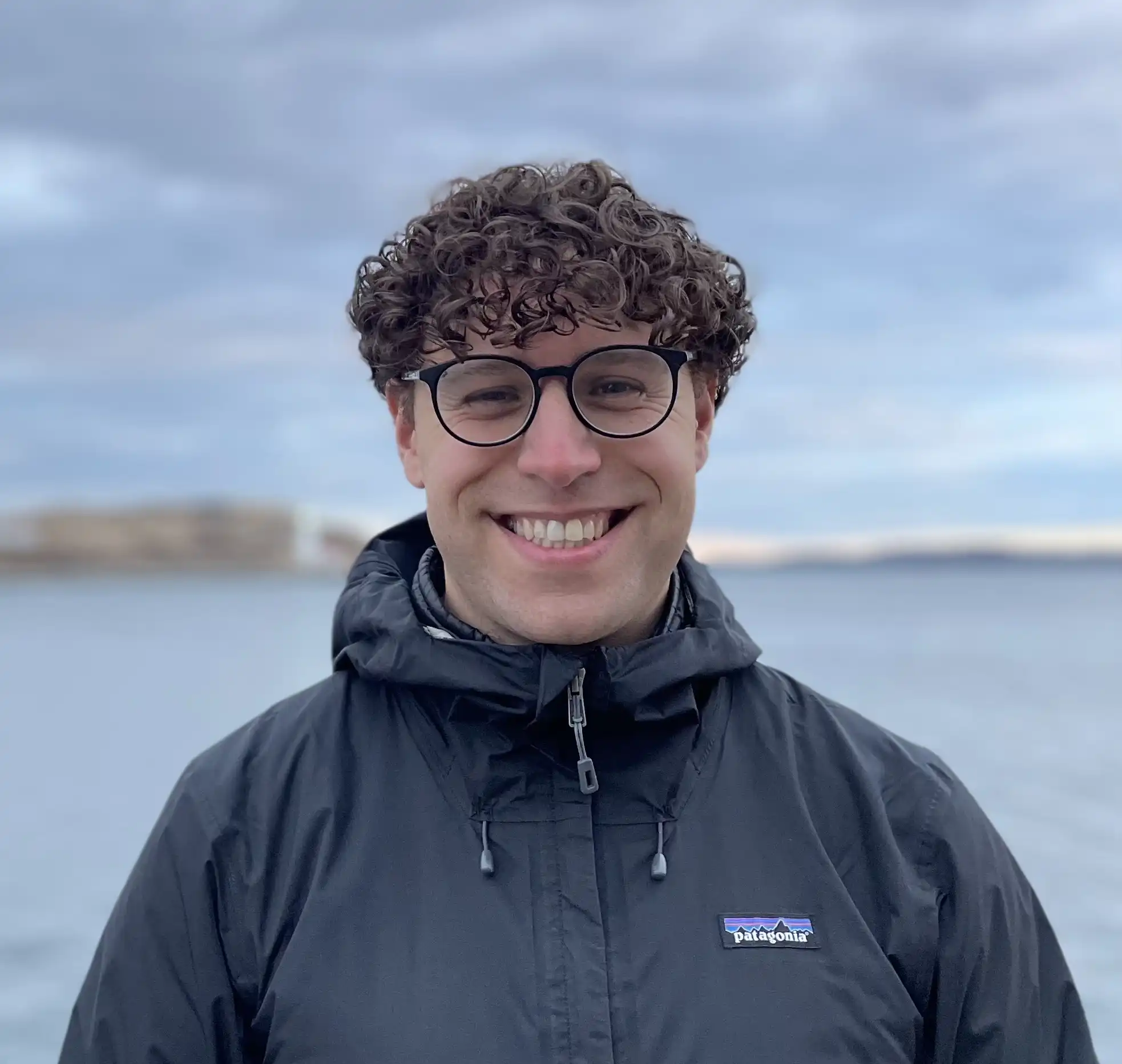 photo of Curtis in front of Halifax Harbour